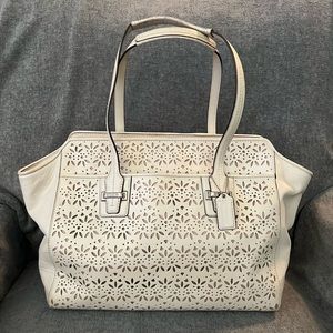 Coach, Taylor eyelet leather carryall tote. I’m fair condition.